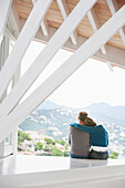 Couple admiring view from balcony, Palma de Mallorca, Balearic Islands, Spain