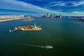 Aerial view of the Statue of Liberty. Manhattan in the background. Hudson Bay
