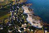 aerial view of a village to the beach. The ocean on the right