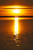 Iceland. Southern region. Skogar region. Sunset on the lagoon Holtsos. Right the Westman Islands.