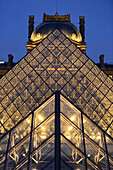 France. Vertical view and téléoblectif two pyramids of the Louvre in Paris by night
