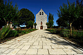 Mayrac Lot, facade of a church and its path marked trees