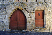 France Cahors, medieval facade, two doors with an arched