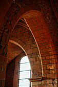 France, Collonges la Rouge, Correze. Pointed arches of red stone