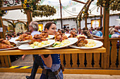 Germany, Bavaria, Munich, Oktoberfest, Waitress with Food Platters