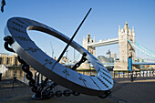 'A large circular sculpture on the riverbank of the River Thames; London, England'