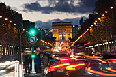 'Champs Elysees and Arc de Triomphe decorated for Christmas at dusk; Paris, France'