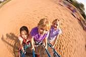 Children Spinning On Playground