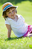 Girl Sitting On Grass