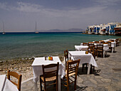 Tables And Chairs With An Ocean View, Greek Islands, Greece