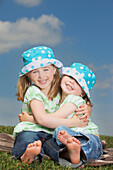 Two Young Girls Hugging