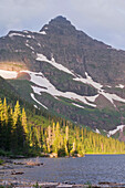 'Montana, United States Of America; Sunrise Over Upper Two Medicine Lake And Lone Walker Mountain In Glacier National Park'