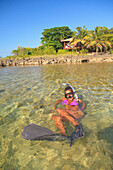 'Roatan, Bay Islands, Honduras; A Young Woman Snorkeling At Anthony's Key Resort'