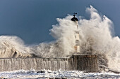 'Waves Crashing Up Against A Lighthouse; Seaham, Teesside, England'