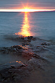 'Rocky Shoreline Of Lake Superior At Sunset; Wawa, Ontario, Canada'