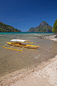 'A Tradional Wooden Bangka Boat Sits In The Picturesque And Scenic Bay; El Nido, Bacuit Archipelago, Palawan, Philippines'
