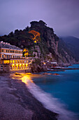 'A Building Illuminated At Night Along The Coast; Camogli, Liguria, Italy'