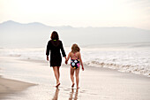 'Mother And Daughter Walking On The Beach; Puerto Vallarta, Mexico'