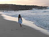 Girl Walking On The Beach