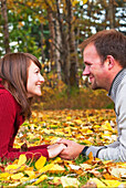 'Young Married Couple Spending Quality Time Together In A Park In Autumn; Edmonton, Alberta, Canada'