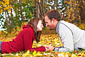 'Young Married Couple Spending Quality Time Together In A Park In Autumn; Edmonton, Alberta, Canada'