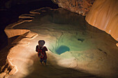 'A Filipino Tour Guide Holds A Lantern Inside Sumaging Cave Or Big Cave Near Sagada; Luzon, Philippines'