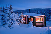 View Of La Mesange Shelter And Snow-Covered Trees At Twilight, Quebec, Canada