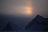 Rainbow Over Ridge On A Glacier In The St. Elias Mountains