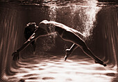 'A Woman In A Bikini Floats Underwater; Tarifa, Cadiz, Andalusia, Spain'