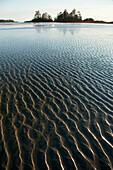 'Ripples Form In The Sand At Chesterman's Beach And Frank Island Near Tofino; British Columbia, Canada'