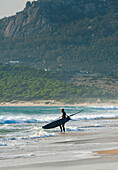 'Windsurfer Standing On The Beach; Tarifa, Cadiz, Andalusia, Spain'