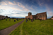 'Path Leading To A Church Building And Cemetery; Bamburgh, Northumberland, England'