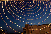 'Small White Lights Strung In A Circular Pattern Against A Night Sky; Ludhiana, Punjab, India'