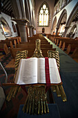 'An Open Bible On A Gold Podium In St. Andrew's Church; Kelso, Scottish Borders, Scotland'