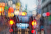 'View of a car's tail lights through a wet windshield;Amsterdam holland'