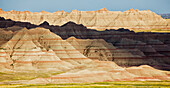 'Light and shadows paint the landscape of badlands national park; south dakota united states of america'