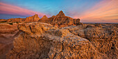 'Twilight over the hoodoos and rock formations in badlands national park; south dakota united states of america'