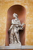 'Theatrical statue on a building framed in an arch;Ravenna emilia-romagna italy'