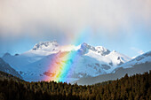 'Rainbows and intermittent showers in tongass national forest with herbert glacier beyond amalga harbor area in spring;Juneau alaska united states of america'
