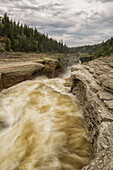 'The Trout River flows over whittaker Falls; Northwest Territories, Canada'