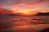 'Incredibly brilliant Wailea sunset as viewed from Keawekapu Beach; Maui, Hawaii, United States of America'