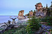 'Monolith at twilight, Anse des Bonnes Femmes at Ile Niapiskau, Mingan Archipelago National Park Reserve of Canada, Cote-Nord, Duplessis region; Quebec, Canada'