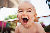 'A baby boy with an excited expression on his face; Toronto, Ontario, Canada'