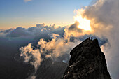 Sunrise: mountaineers on the Mitteleggi-Ridge, Eiger (3970 m), Bernese Alps, Switzerland