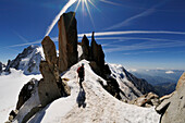 Climber on the Cosmique Ridge at Aiguille du Midi, Mont Blanc, France