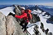 Mountaineer on the ridge of Tour Ronde, Mont Maudit, Mont Blanc Group, France