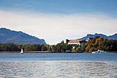 View over Chiemsee to the Old Castle on Herreninsel, near Gstadt, Chiemsee, Chiemgau region, Bavaria, Germany