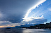 View along coast to Mount Etna, Taormina, Messina, Sicily, Italy