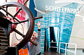 Boy at a wheel, Transport Museum, Dresden, Saxony, Germany