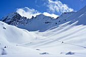 Two back-country skiers ascending to Piz Laschadurella, Sesvenna Alps, Engadin, Graubuenden, Switzerland